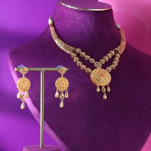 Set of gold necklaces Gunes Altin containing circle sun motifs, teardrop pendants and a pair of ear tops.